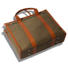 Brown bag with leather straps on a white background