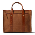 Brown leather tote bag on a white background