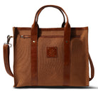 Brown leather tote bag with a visible brand logo on a white background