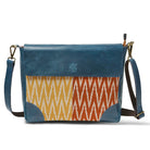 Blue and patterned shoulder bag on a white background