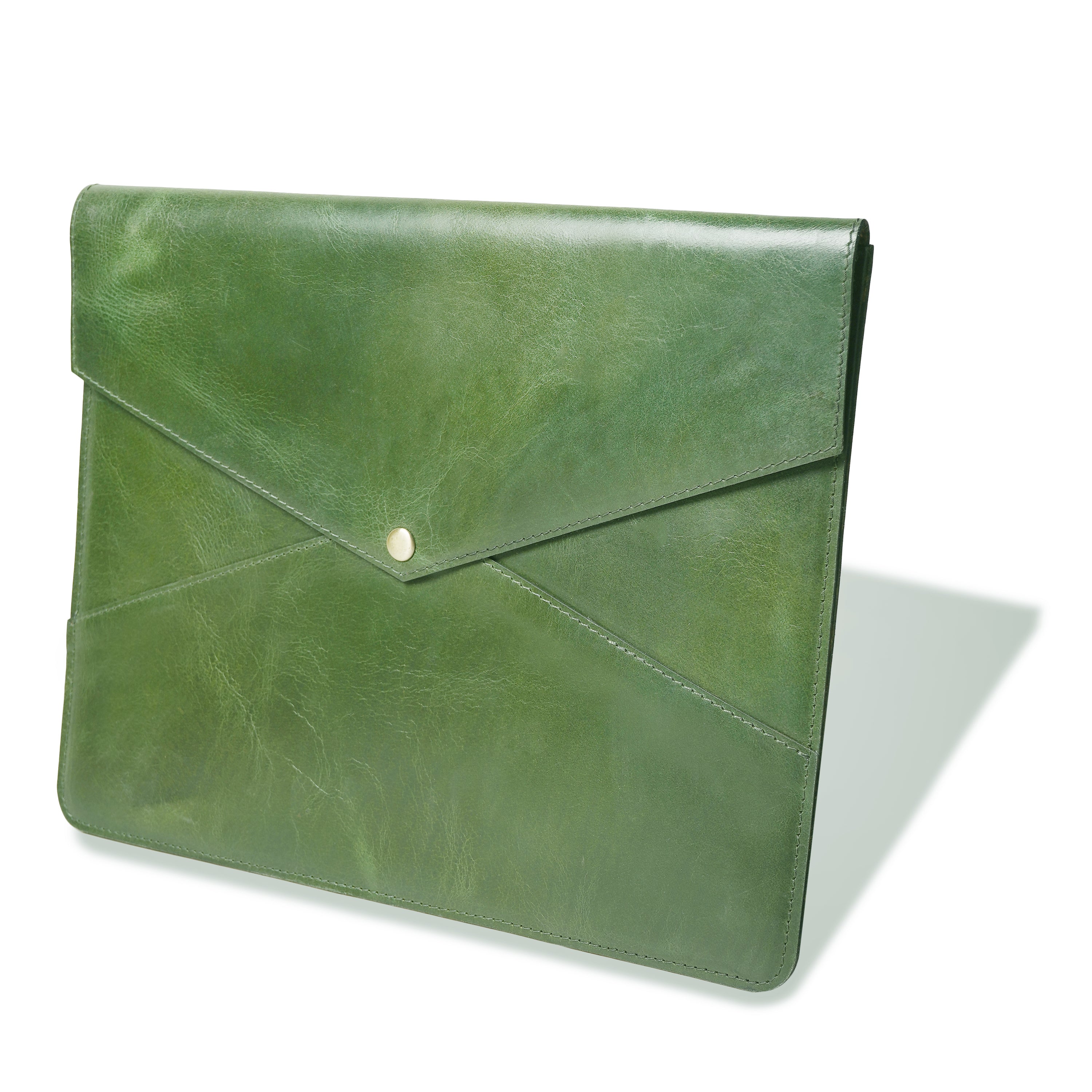 Green leather clutch bag on a white background