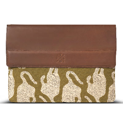 laptop with brown leather top and tiger patterned fabric on a white background