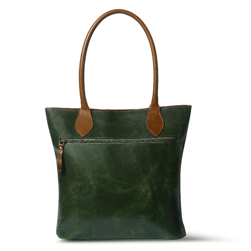 Green leather tote bag with brown handles and accents on a white background