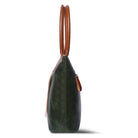 Green leather handbag with brown handle on a white background