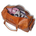 Brown leather duffel bag with clothes spilling out on a white background