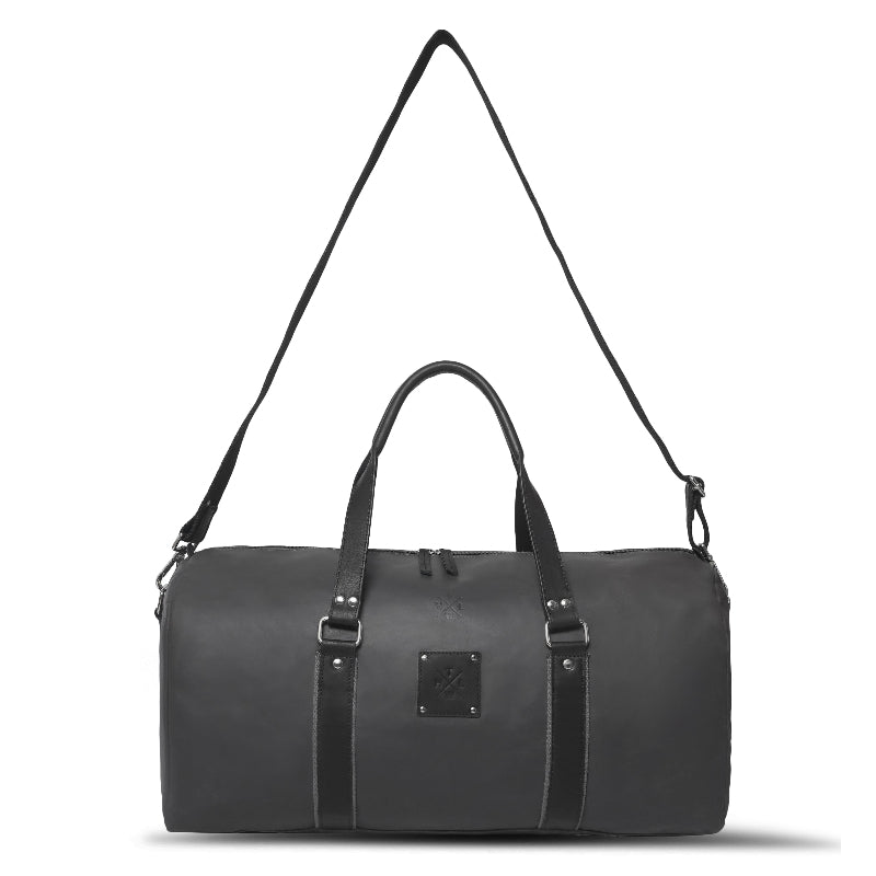 Black duffel bag with straps on a white background