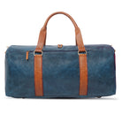 Blue duffel bag with brown straps on a white background