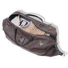 Brown duffel bag with clothing items on a white background