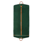 Green garment bag with brown straps on a white background