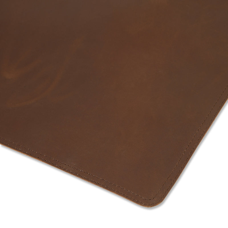 Brown leather placemat on a white background