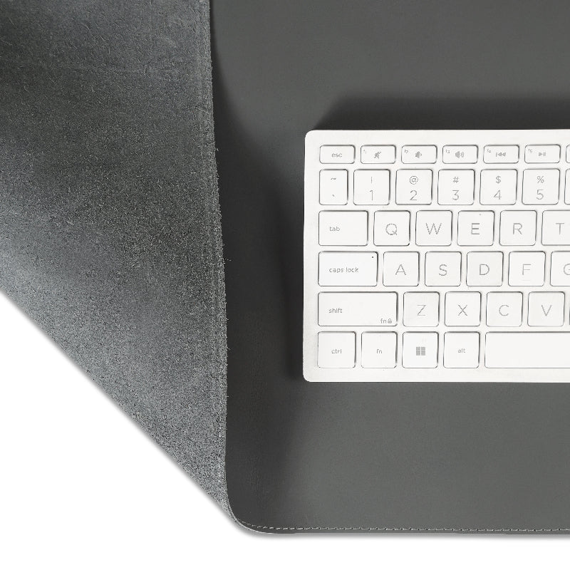Gray desk mat with a built-in keyboard on a gray desk mat