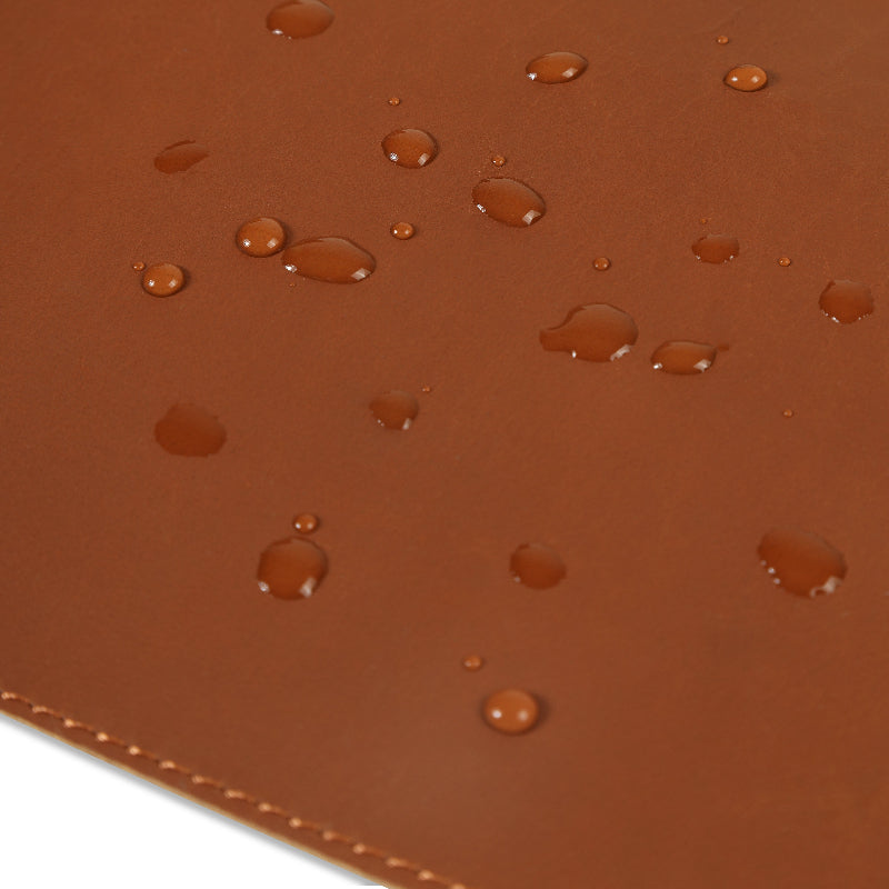 Brown leather desk mat with water droplets