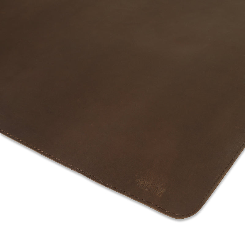 Brown leather mouse pad with brand logo on a white background