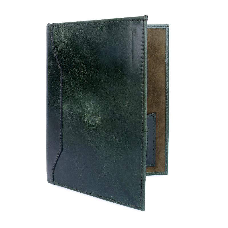 Green leather menu cover with brown interior on a white background