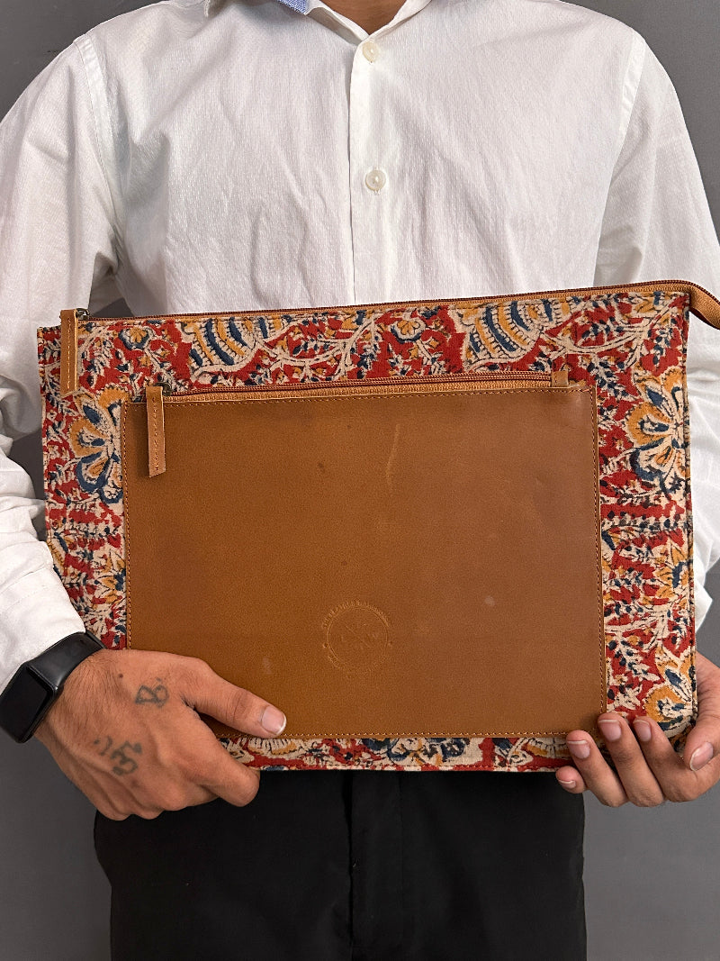 Person holding a leather sleeve with decorative cover