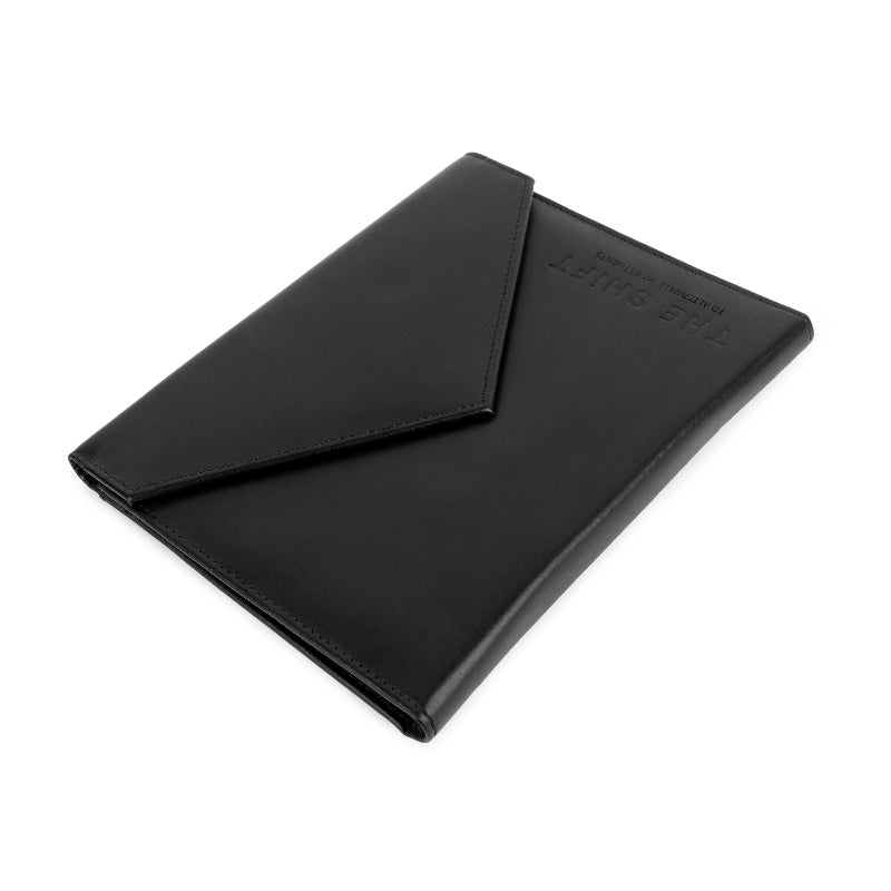 Black leather menu cover with a flap on a white background