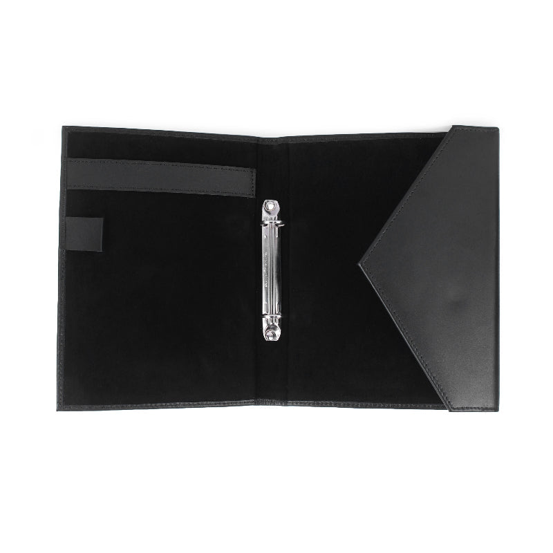 Black leather menu cover with a silver clip on a white background