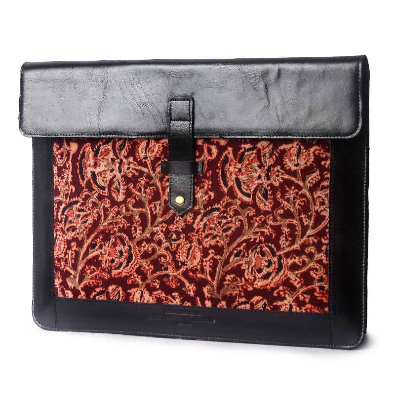 Black leather sleeve with red paisley pattern on a white background