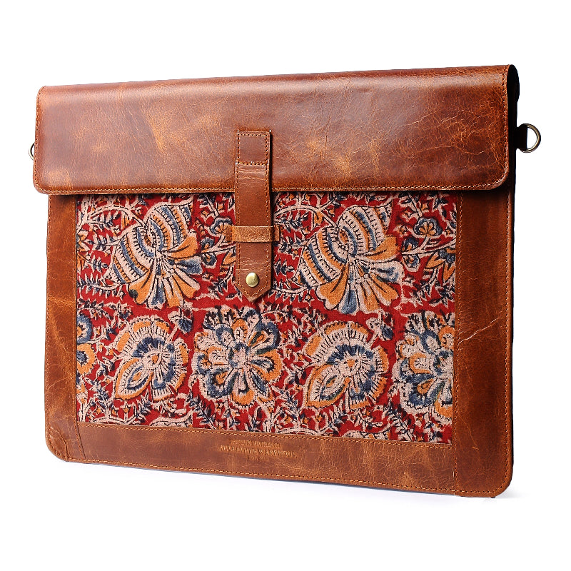 Brown leather sleeve with a colorful paisley pattern on a white background
