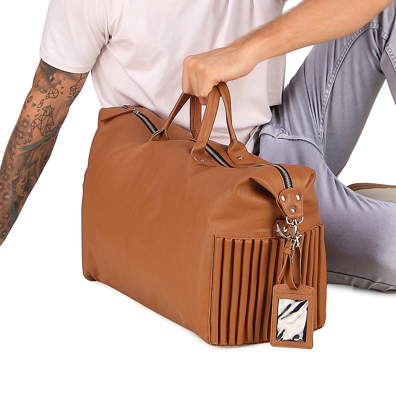 leather duffle bag with luggage tag