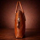 Brown leather handbag on a wooden surface with a brown background