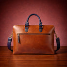 Brown leather briefcase with blue handles and strap on a wooden surface and red background