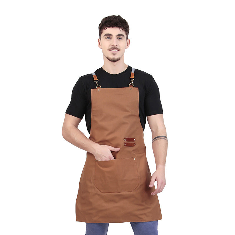 Man in brown apron with front pocket and adjustable straps on white background.