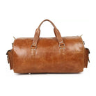 Brown leather duffel bag on a white background