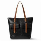 Black tote bag with brown straps on a white background