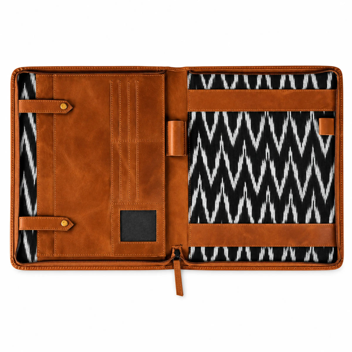 Open brown leather portfolio organizer with card slots, pen holders, document straps, and a black-and-white patterned interior.