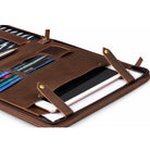 Open black leather zippered portfolio with a notepad held by elastic straps on the right, and card slots with hook