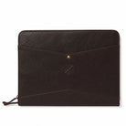 Black leather pouch with a gold button on a white background