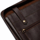 Black leather file folder with zipper on a white background, showing dimensions.