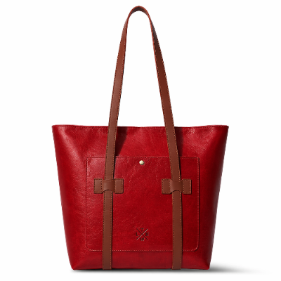 Red tote bag with brown straps on a white background