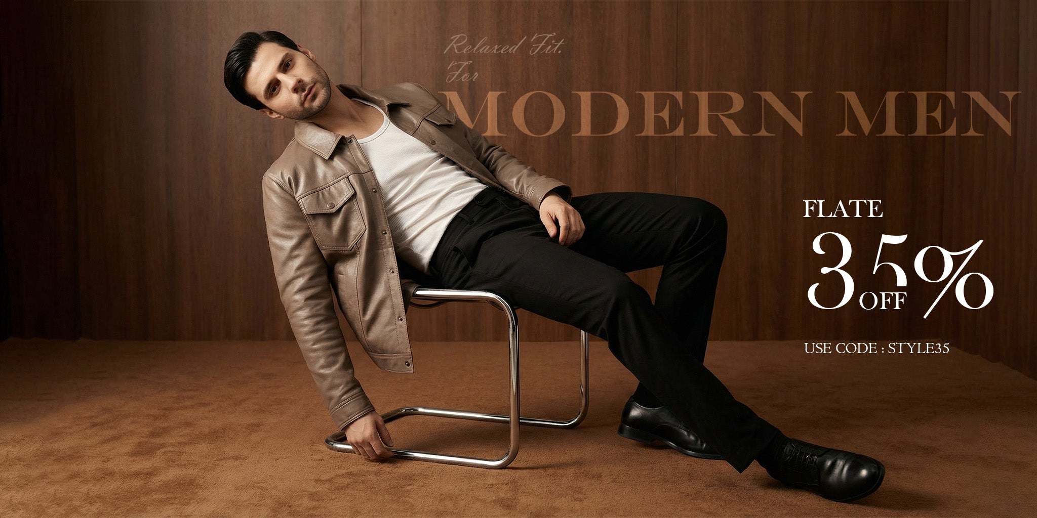 Man sitting on a chair wearing a stylish outfit with promotional text overlay.