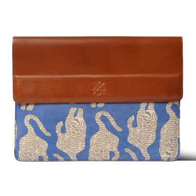 laptop sleeve with brown leather top and blue fabric with tiger pattern