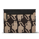 Black laptop sleeve with beige animal pattern on a white background