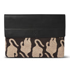 Black laptop sleeve with beige tiger  pattern on a white background