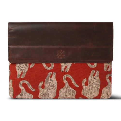 Brown leather laptop sleeve with red and tiger pattern on a white background