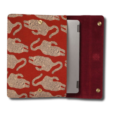 laptop sleeve with  beige tiger pattern holding a silver device on a white background