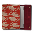 Red laptop sleeve with beige tiger pattern holding a silver device on a white background