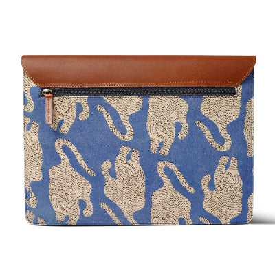 Blue laptop sleeve  pattern and brown leather flap on a white background