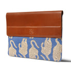laptop sleeve with brown top section and blue base featuring animal pattern on a white background