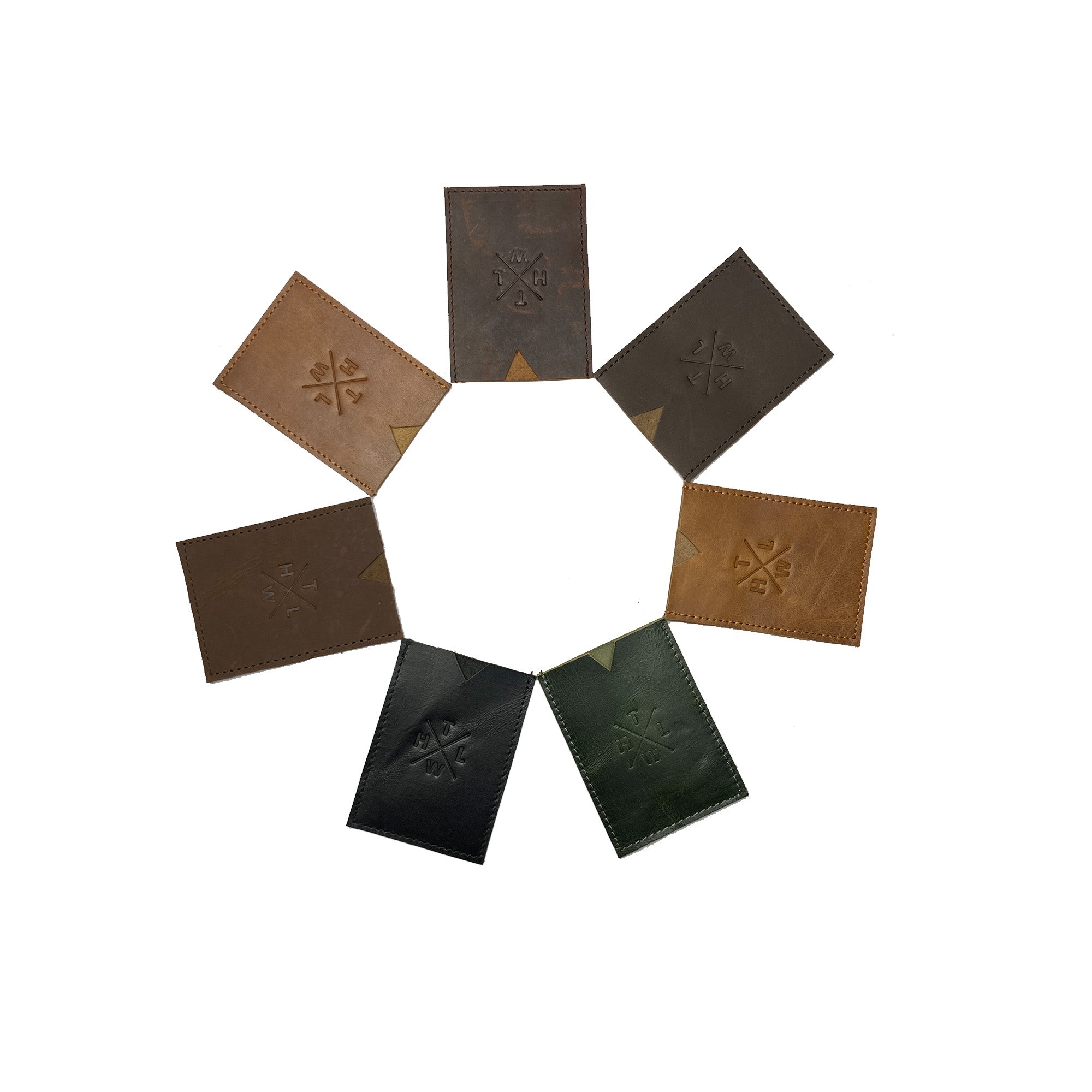 Set of eight leather coasters with embossed designs arranged in a circular pattern on a white background.