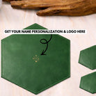 Green leather hexagonal placemat with a logo on a light background