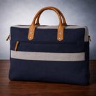 Navy blue canvas bag with beige accents on a wooden surface