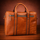 Brown leather bag with zippers on a wooden surface and brown background