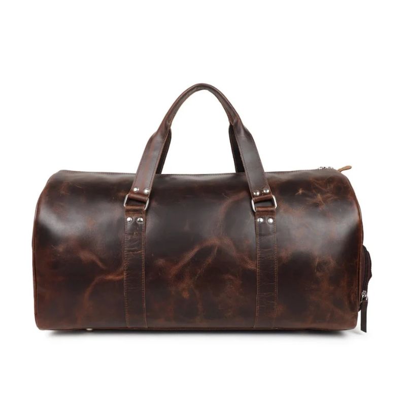 Brown leather duffel bag on a white background