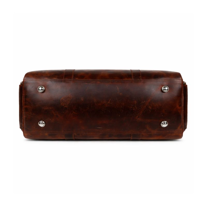 Brown leather bag with silver studs on a white background