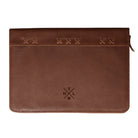 A brown leather zippered sleeve with decorative stitched details across the top and an embossed THLW monogram logo near the bottom center, shown against a plain white background.